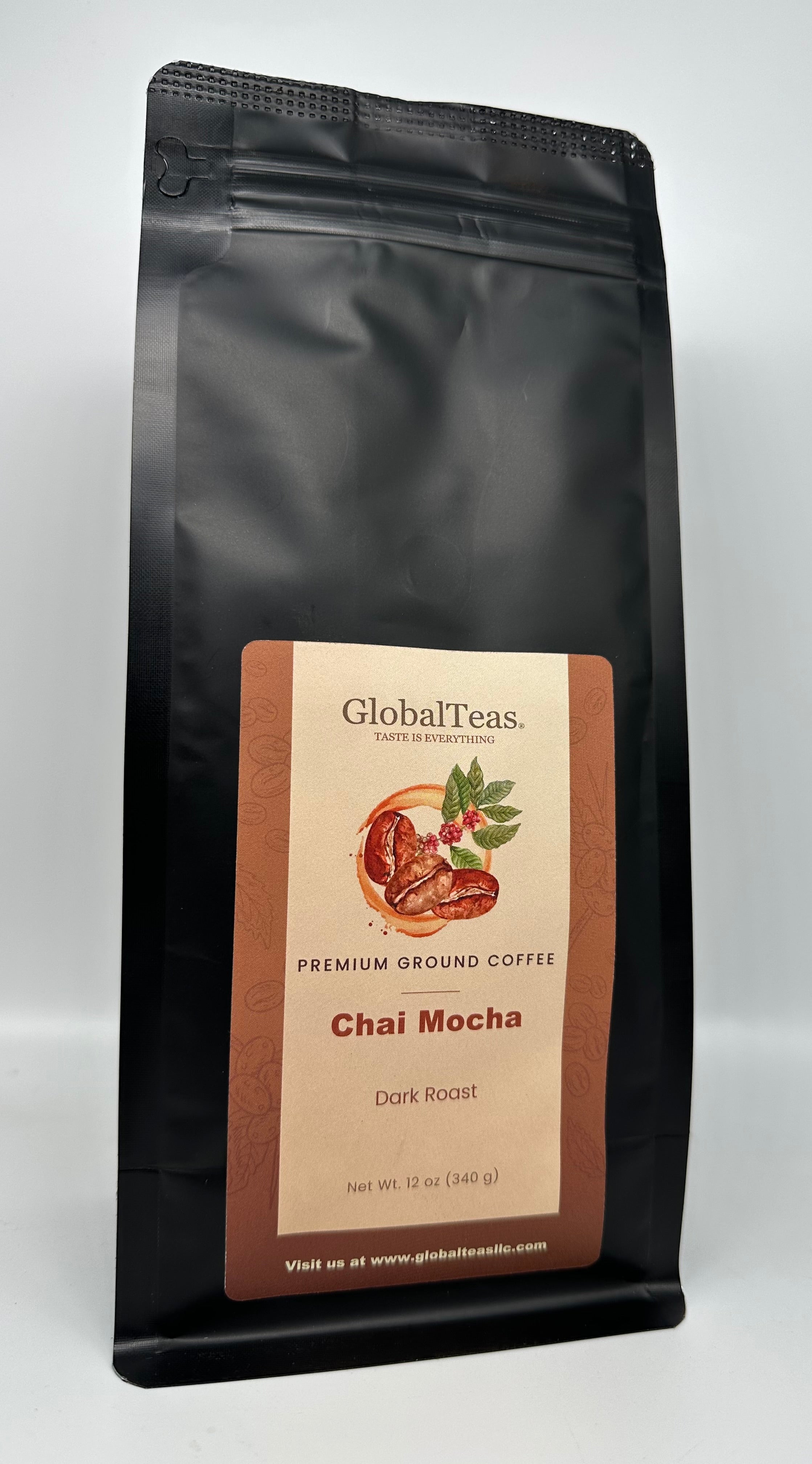 A black coffee bag labeled "GlobalTeas Premium Ground Coffee" featuring "Chai Mocha" and "Dark Roast" with coffee beans illustration.