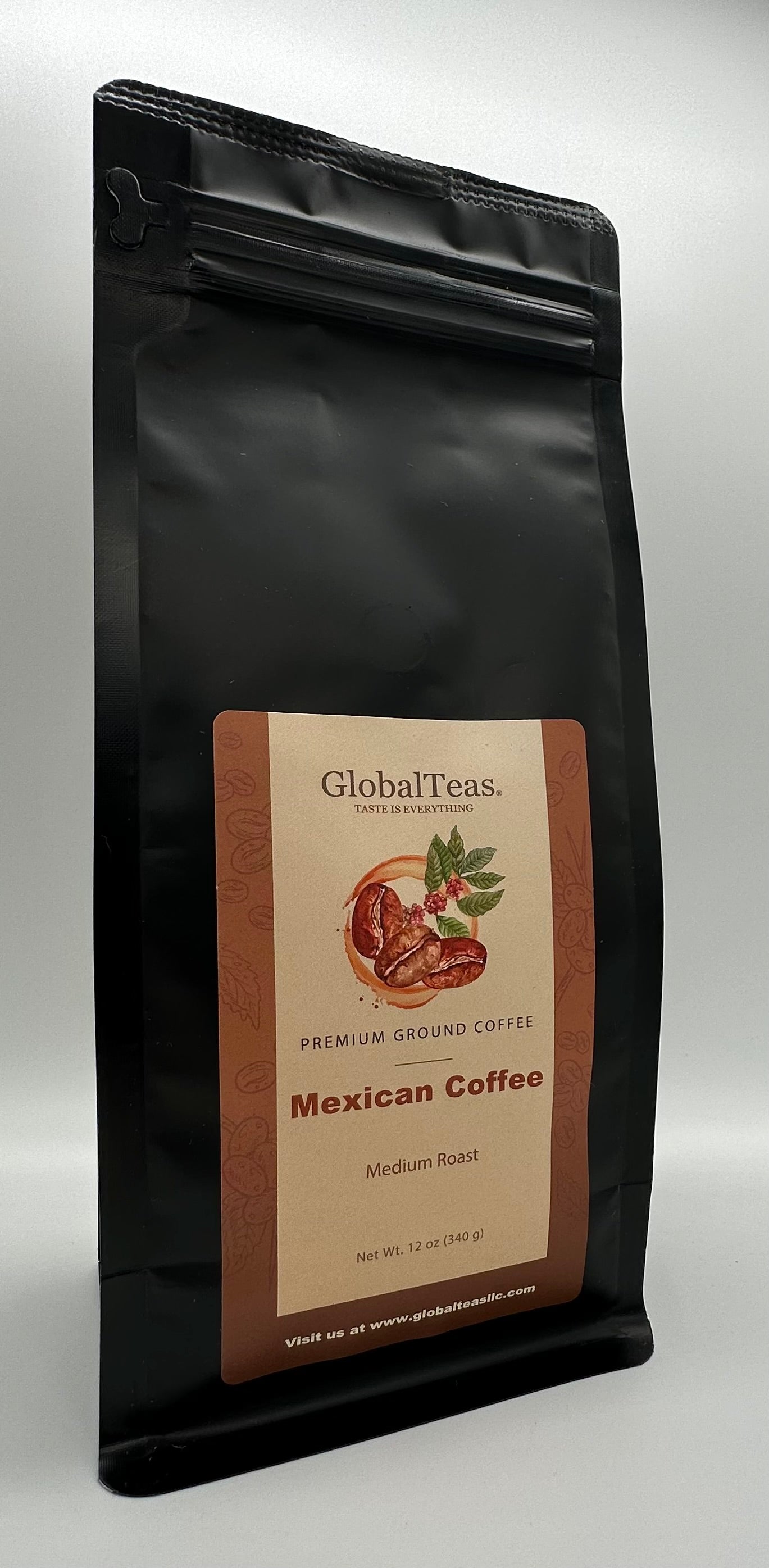 Black coffee bag labeled "GlobalTeas Premium Ground Coffee - Mexican Coffee, Medium Roast, 12 oz." against a gray background.