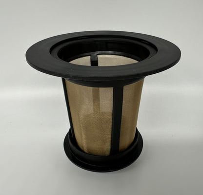 A close-up of a reusable premium coffee filter with a black rim and fine mesh interior, set against a neutral background.