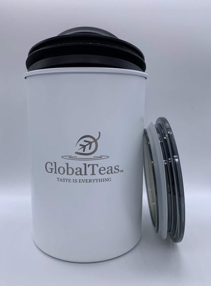White tea canister with a black lid and the logo "GlobalTeas: Taste Is Everything" displayed prominently on the front.