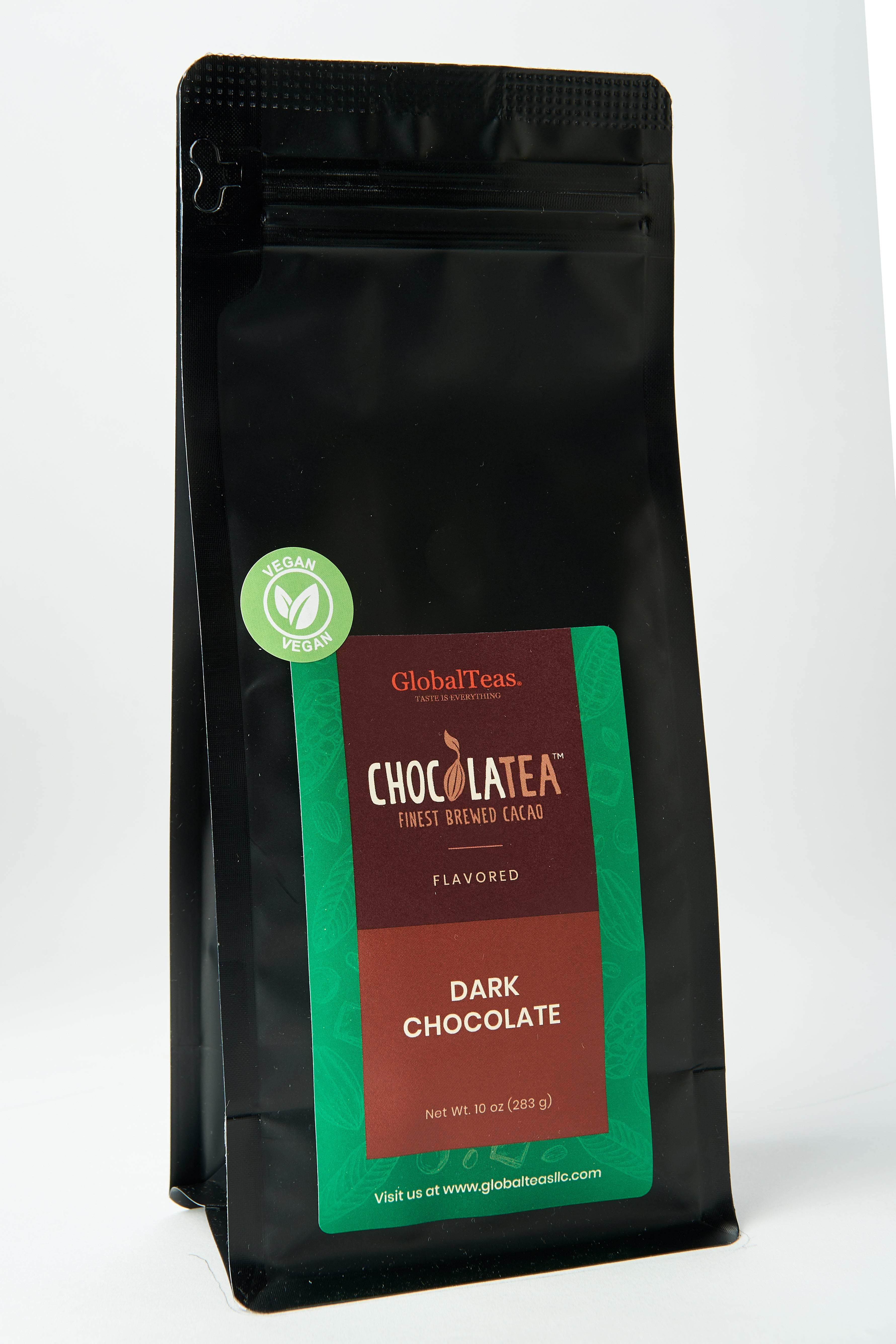 Black package labeled "Chocolatea Dark Chocolate," vegan, with green and brown decorative design.